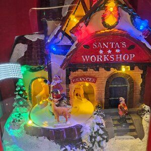 North Spruce Lane No. 14 Animated Musical LED Santa’s Workshop – Plays 8 Songs